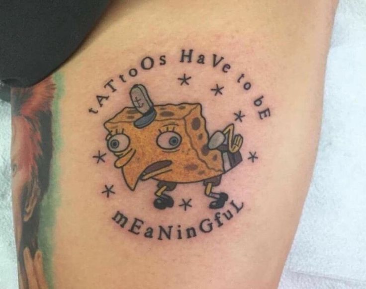 Sponge bob squarepants making fun of stuff meme tattooed onto someone with caption making…