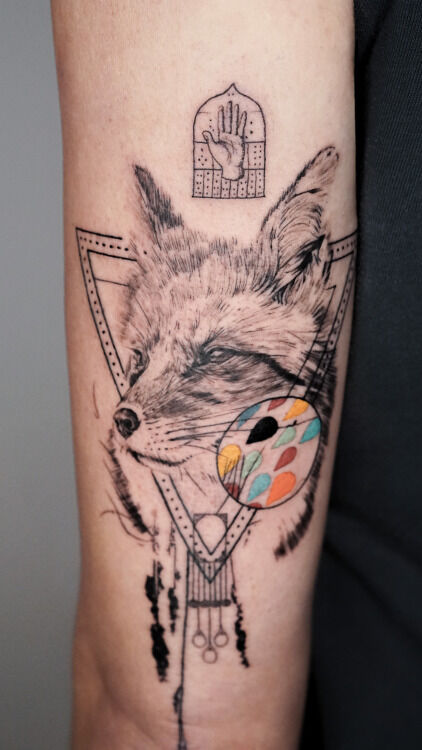 fox tattoo on arm with geometric elements and color drops done