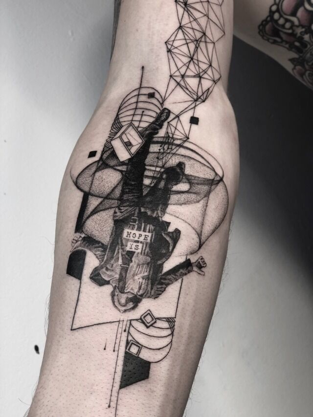 cool geometric arm tattoo design in black human figure hopedone by koittattoo artist based in