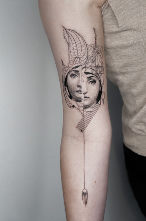 tattoo with surrealistic woman face plants and geometric