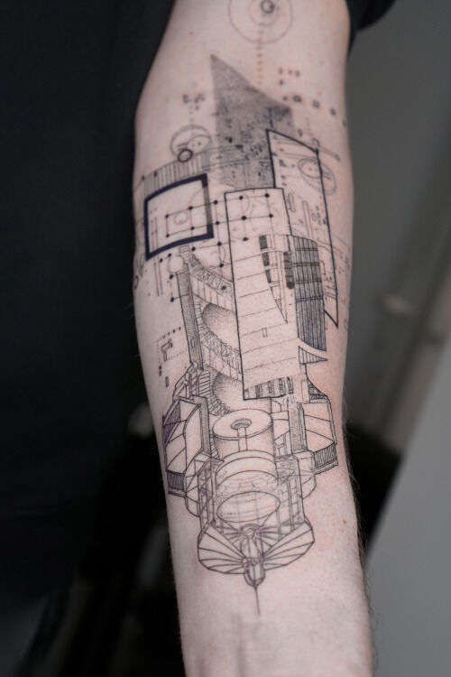 lighthouse geometric abstract tattoo on forearm with graphic