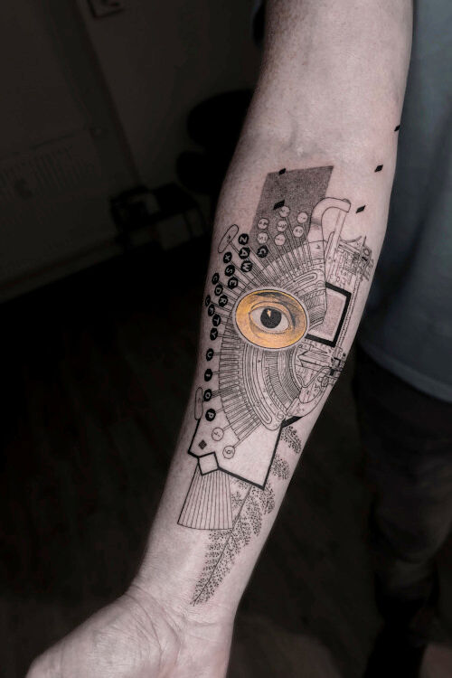 typewriter geometric forearm tattoo art in graphic style done